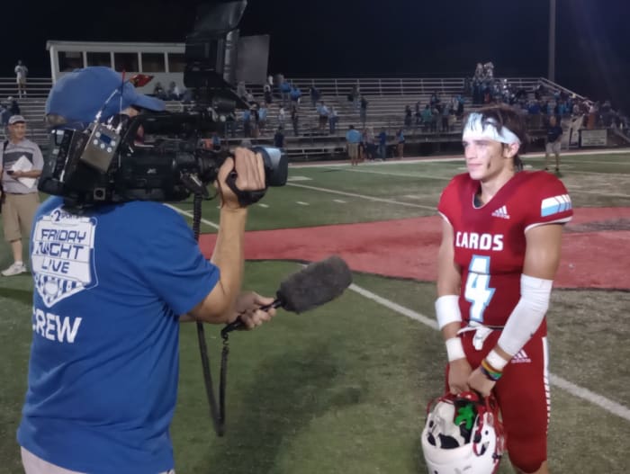Collinsville senior Hudson Henslick (right) is interviewed by a local TV crew after his 3-TD performance in a 27-14 win against Bartlesville on Sept. 15, 2023.